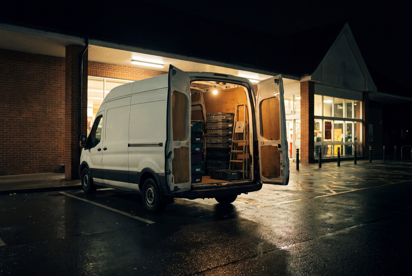 Crew van loaded with fixtures and materials ahead of a fit-out shift.